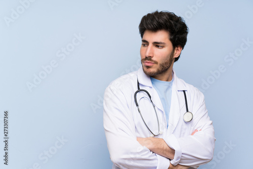 Doctor man standing and thinking an idea