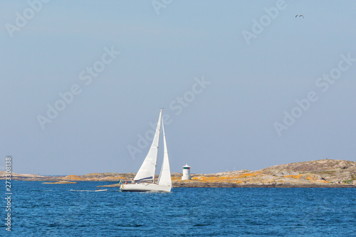 Sailboat in rocky archipelago