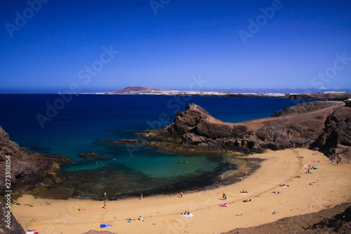 View from steep cliff into blue lagoon beach - Playa Papagayo, Playa Blanca - Lanzarote