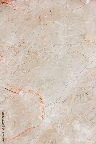 marble brown decorative wall with patterns, stains and cracks