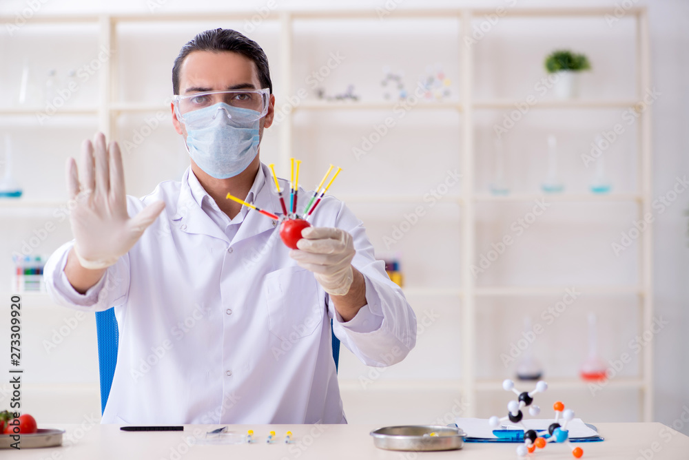 Male nutrition expert testing food products in lab Male nutrition expert testing food products in lab
