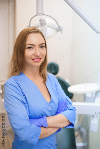 Portrait of modern dentist woman at work.
