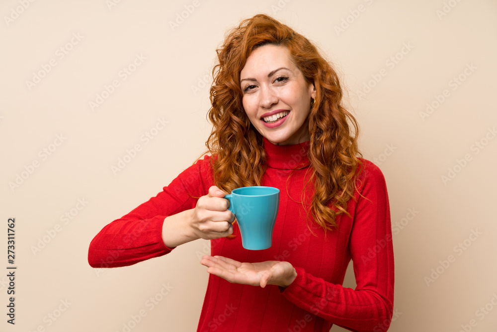 Redhead woman with turtleneck sweater holding hot cup of coffee Redhead woman with turtleneck sweater holding hot cup of coffee
