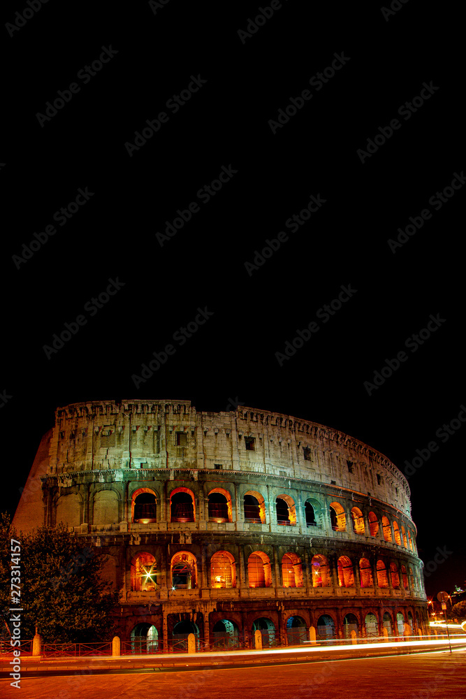 Front view of wonderful ancient Colosseum at night illumination, Rome, Italy