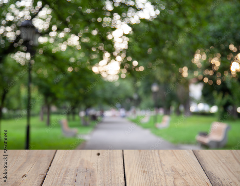 Blurred background of forest park garden with wooden table Blurred background of forest park garden with wooden table