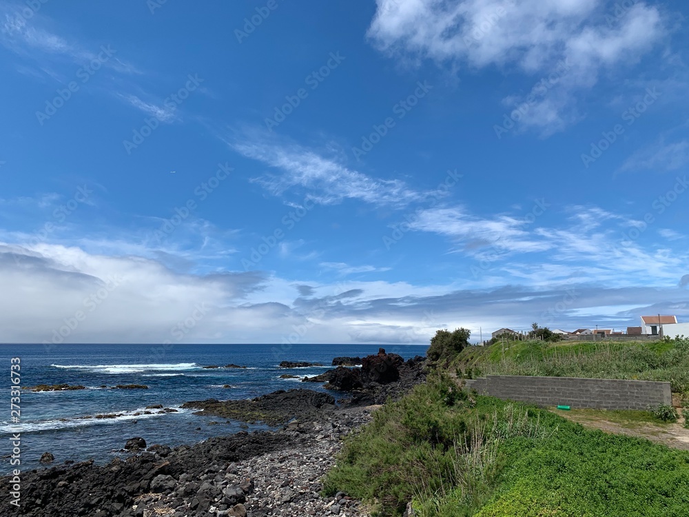 landscape with sea and blue sky on São Miguel island, Azores, Portugal near Ponta De Mosteiros