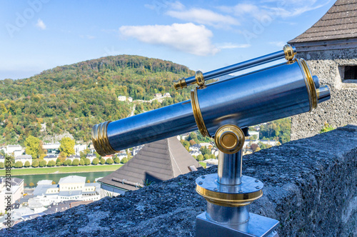Telescope on viewpoint to panoramic city in castle in Salzburg Austria