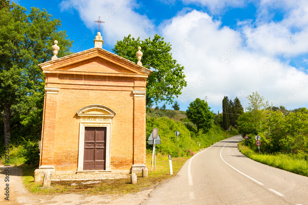 Small church in countryside in a spring day in Tuscany, Italy