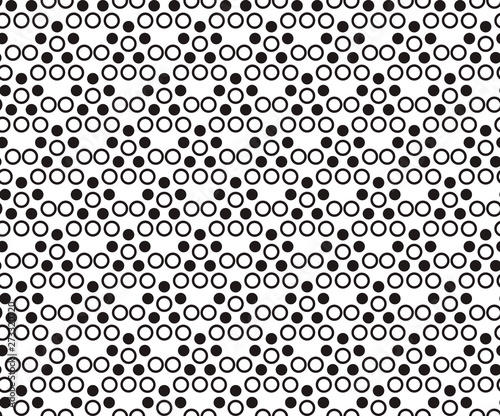Seamless pattern with black dots and rings on white background. EPS10 vector illustration.