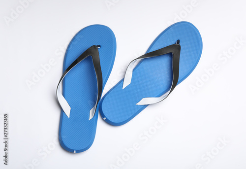 Pair of flip flops on white background, top view. Beach accessories