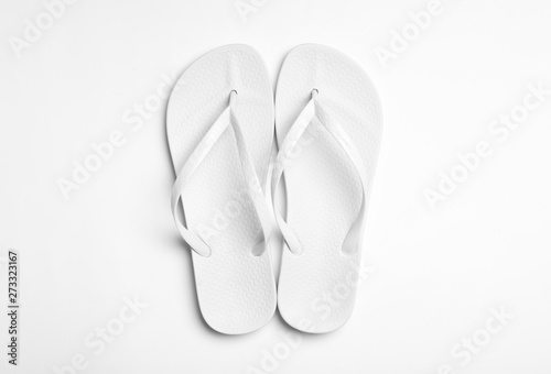 Pair of flip flops on white background  top view. Beach accessories