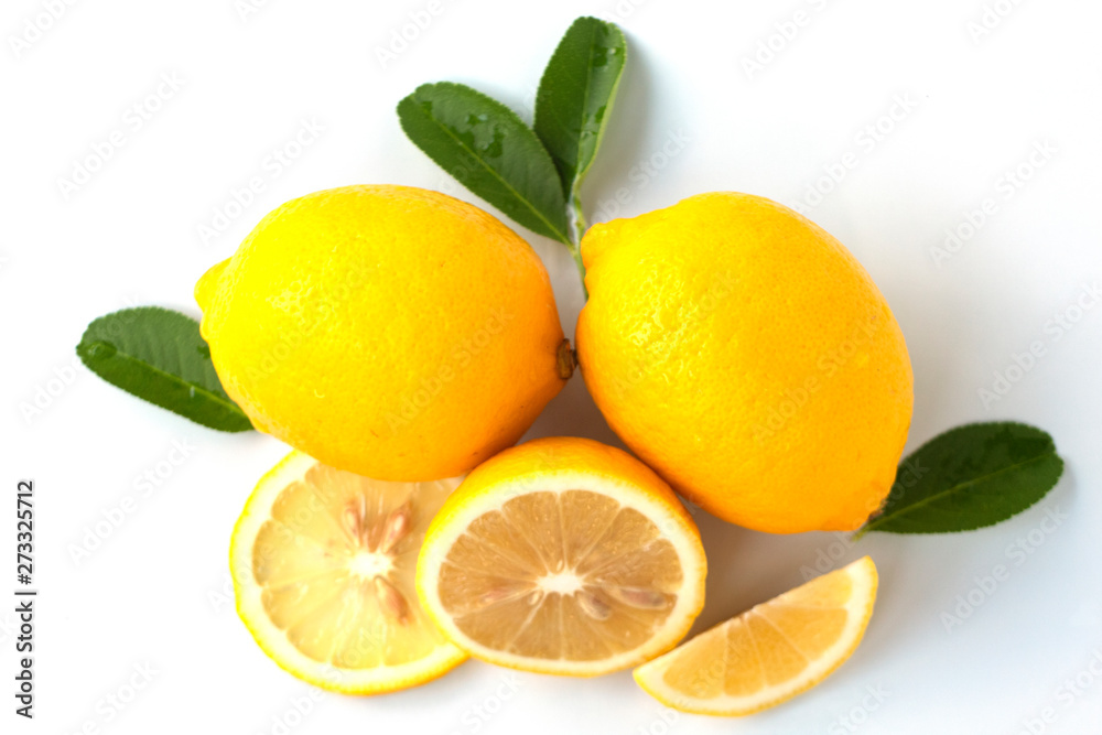 Naklejka fresh lemon with lime and leaves on white background