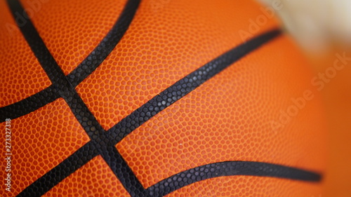 Closeup detail of basketball ball texture background © www.akolosov.art 