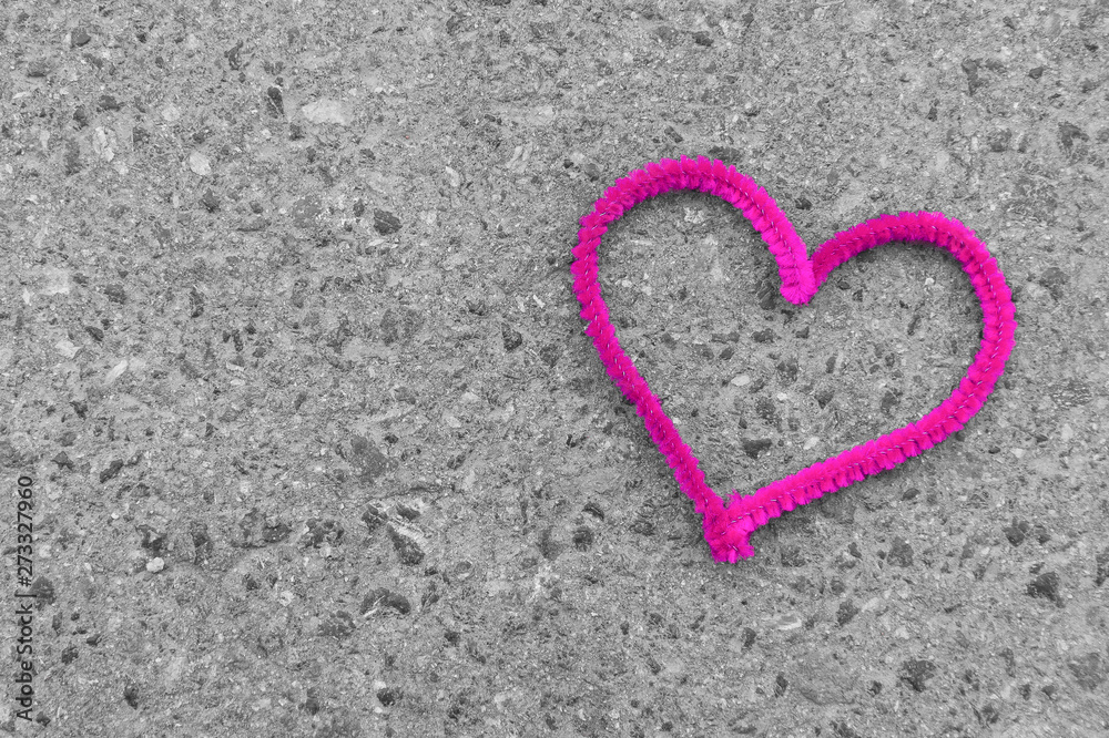 pink heart on asphalt greeting card background