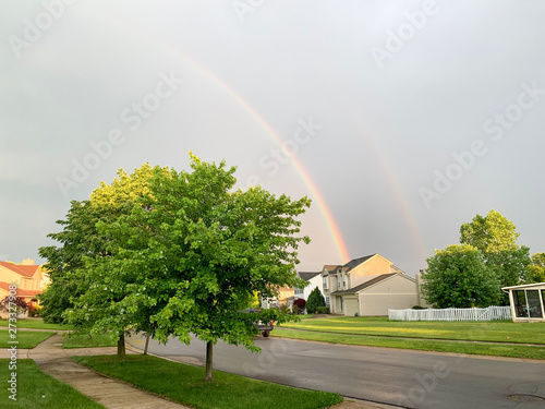 Couple rainbowl over city  Michigan. Rainbow over the city of  Ann Arbor , USA.