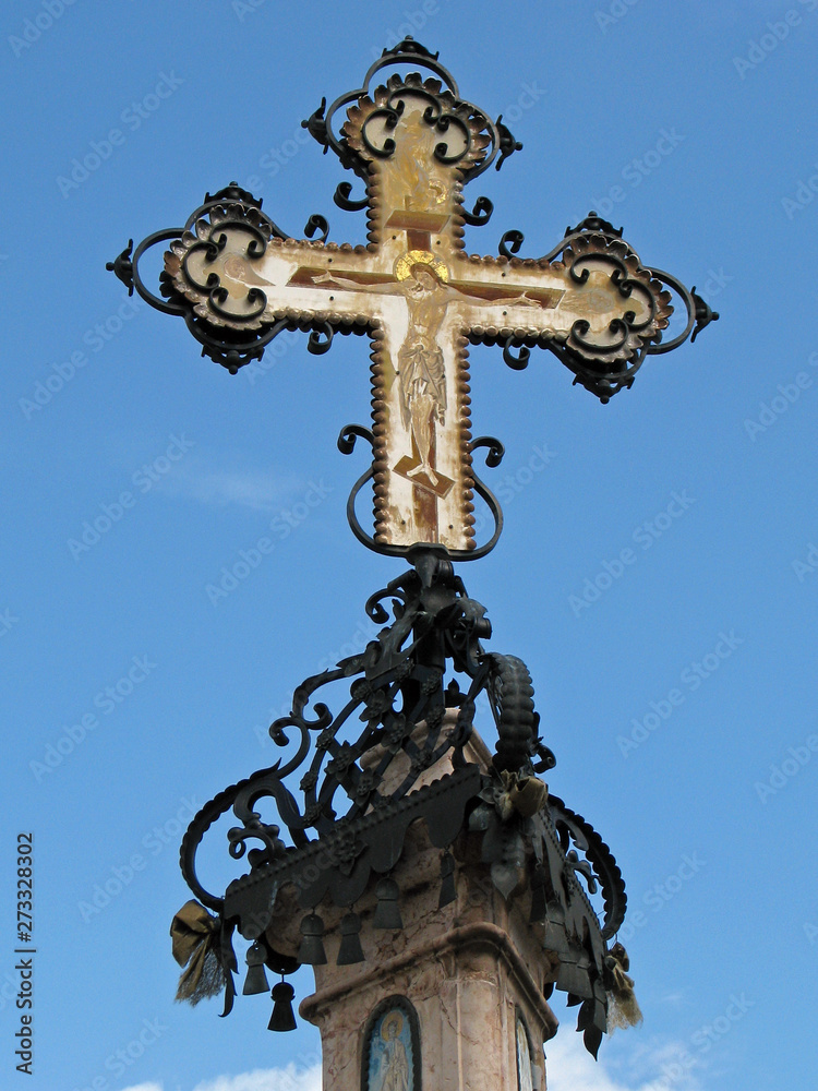 Merchants cross with roof tiles in the background Szentendre, Hungary