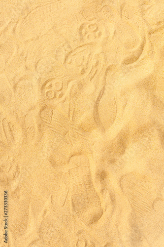 Closeup of sand pattern of a beach in the summer © piyaphong