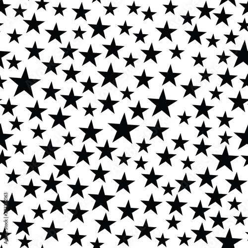 Vector seamless pattern with stars, small black stars on white background. Irregular, chaotic stars texture. Retro style background. Digital print for wrapping paper, fabric,  apparel, web design.