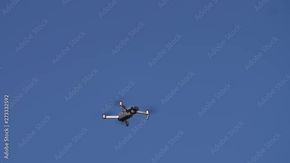 Portable Drone Quadcopter Aircraft flown by a Hobbyist. The clip contains a drone hovering into position and flying away Portable Drone Quadcopter Aircraft flown by a Hobbyist. The clip contains a drone hovering into position and flying away