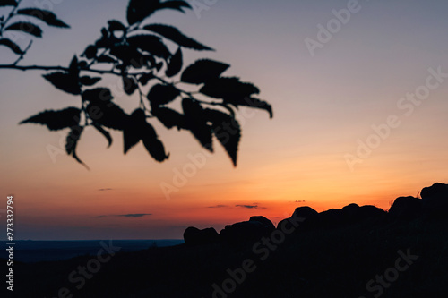 Orange sunset in the sky. The view from the mountain Kazygurt. Nature in Turkestan region of Kazakhstan. photo