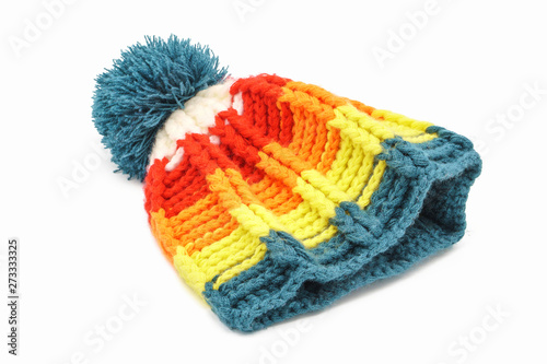 Colorful winter knitted hat on a white background. Handwork. Winter fashion concept for men, women and children.
