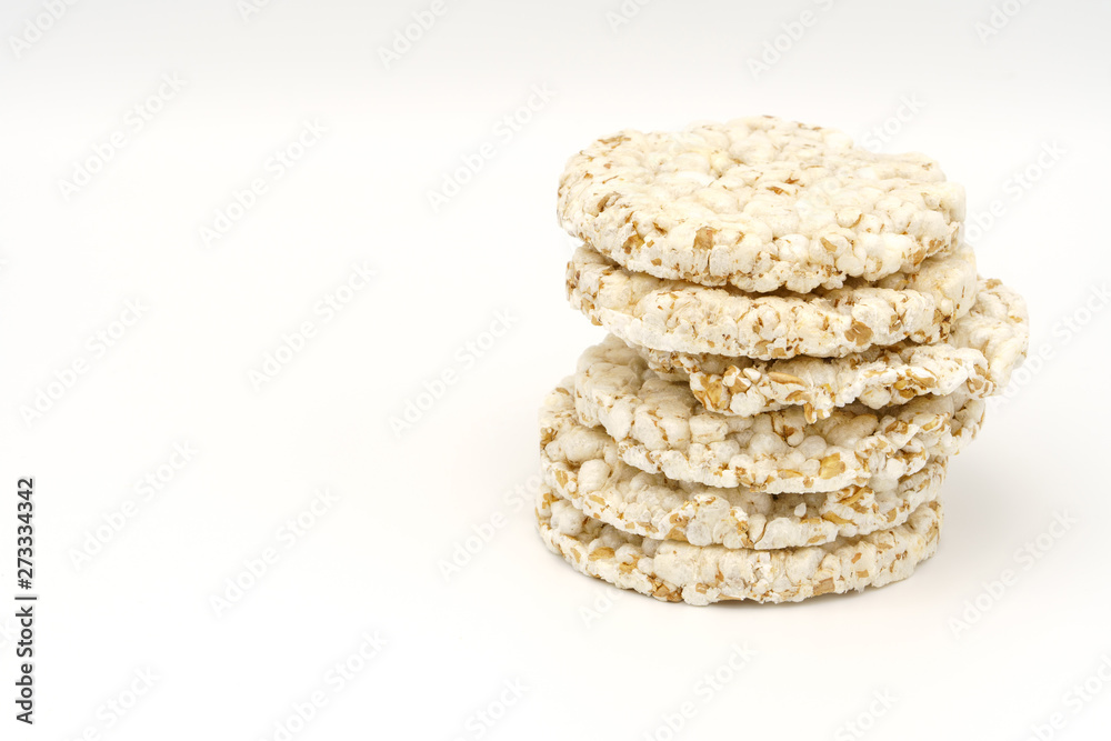Grain crispbreads on white background. Puffed whole grain crispbread. Dieting Eating Concept. Copy space Grain crispbreads on white background. Puffed whole grain crispbread. Dieting Eating Concept. Copy space