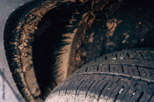 Dirt on a black car. Lack of mudguard on the car. Dirty car arches. Lockers after rain off-road