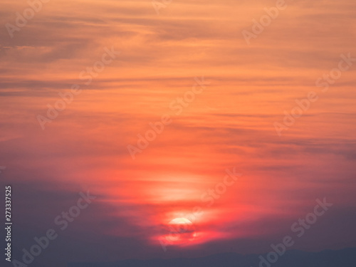 Beautiful orange sunset with clouds. © StockGood