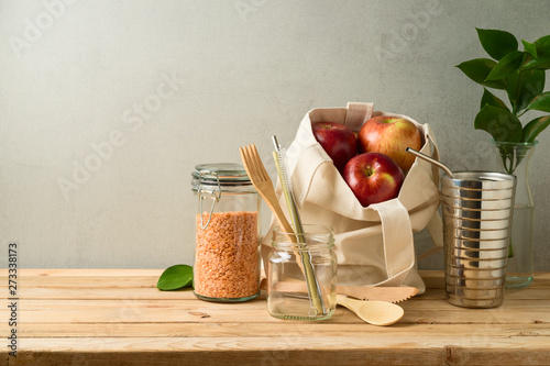 Zero waste lifestyle concept with cotton bag and glass jars on wooden table