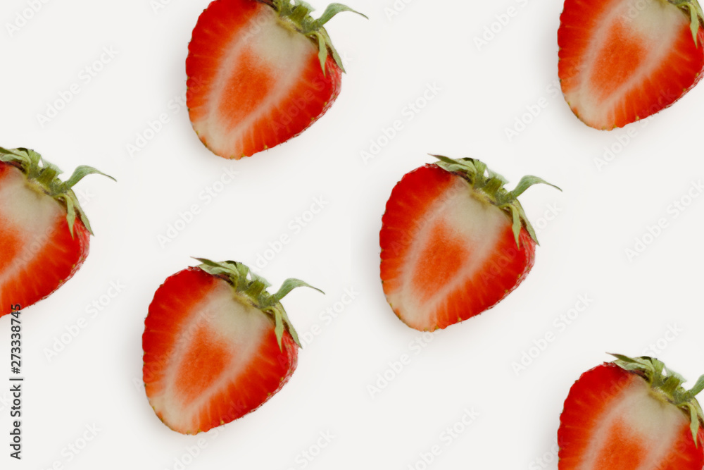 half red strawberry lot on light background closeup half red strawberry lot on light background closeup