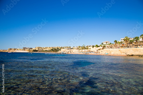 SHARM EL SHEIKH, EGYPT - March 18, 2019: Red Sea Coast, Concord Hotel. Beach with umbrellas, sun beds and palm trees. Background tourism and travel. Rest and vacation.