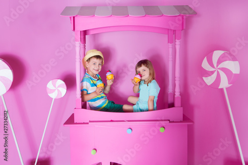 Photography two children with happy birthday cupcake