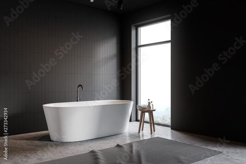 Loft gray tile bathroom corner with tub