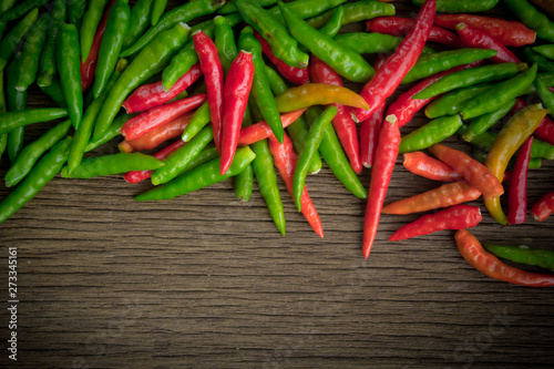 Organic red and green bird's eye chili, bird eye chili, bird's chili, chile de arbol, or Thai chili is a chili pepper, a cultivar from the species Capsicum annuum, commonly found in Southeast Asia..