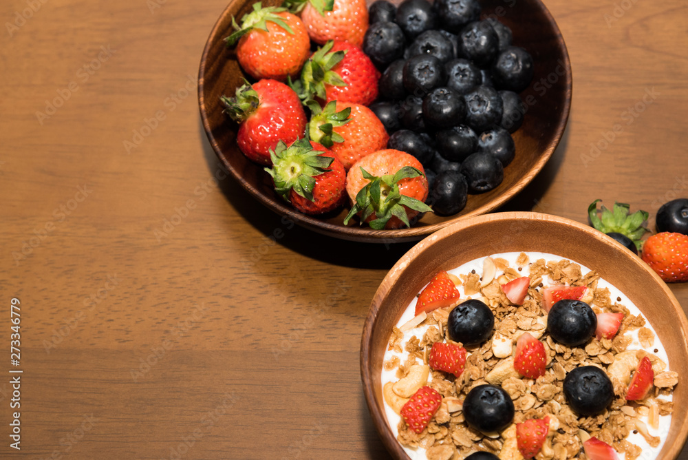 Fresh cereal and milk with strawberry and blueberry in bowl Fresh cereal and milk with strawberry and blueberry in bowl