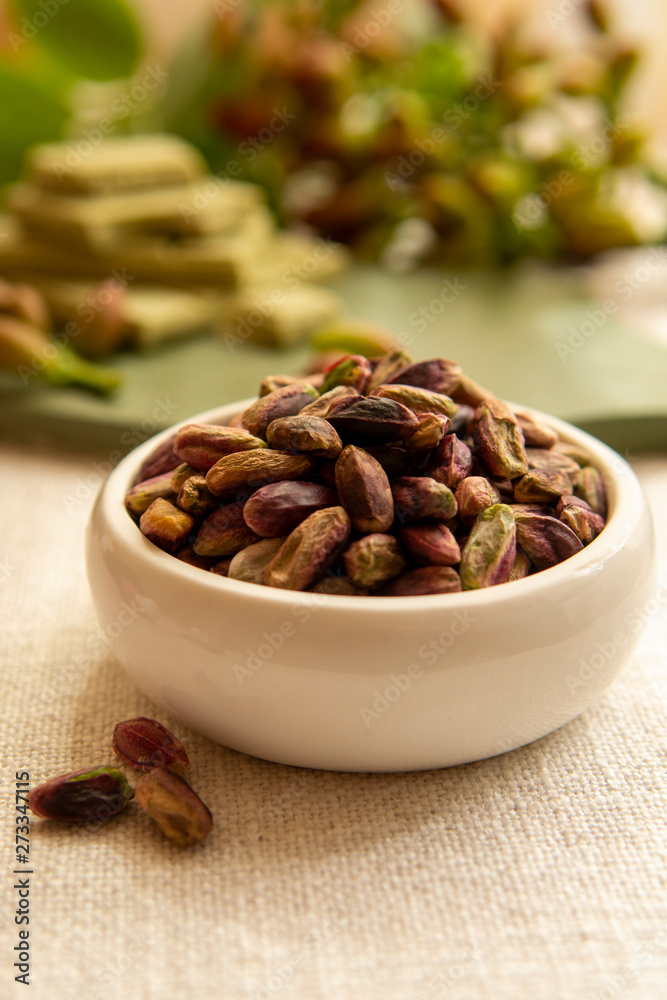 Sweet, delicate and fragrant nuts, Bronte pistachios with brilliant green colour, ingredient for Italian cuisine, ice creams, cakes, pesto Sweet, delicate and fragrant nuts, Bronte pistachios with brilliant green colour, ingredient for Italian cuisine, ice creams, cakes, pesto