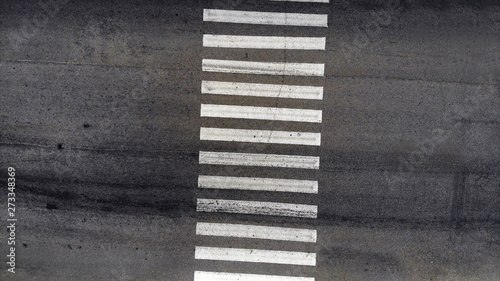 Pedestrian crosswalk zebra with no people, aerial, top view photo