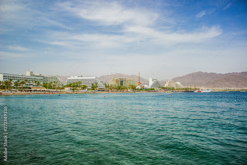 summer vacation destination place panorama photography of harbor Israeli city Eilat on Gulf of Aqaba Red sea bay in Middle East, waterfront with hotels and renting apartment buildings