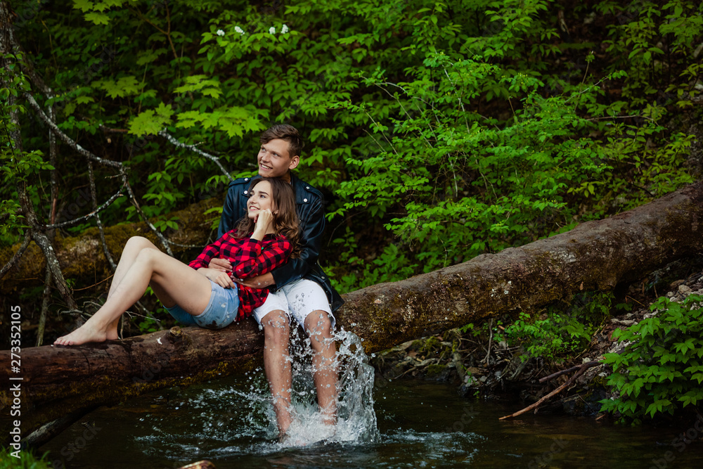 Fototapeta premium Beautiful couple walks in the woods
