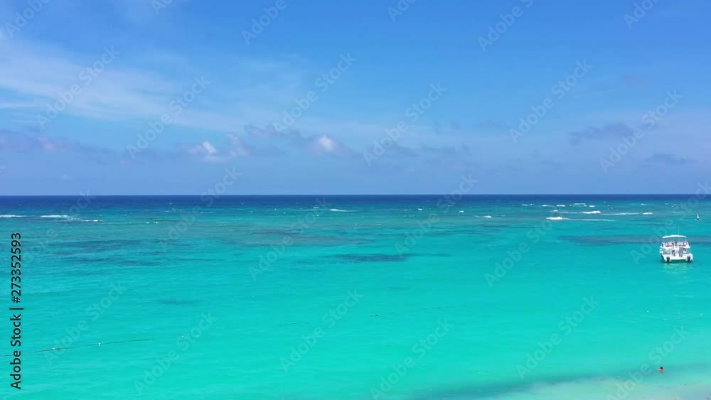 Aerial view from drone on caribbean sea coastline through coconut palm trees. Summer vacation. Travel destination. Dominican Republic Aerial view from drone on caribbean sea coastline through coconut palm trees. Summer vacation. Travel destination. Dominican Republic