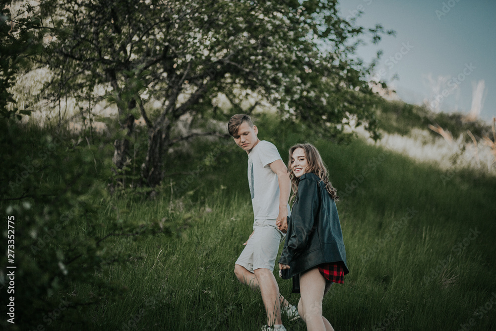 Fototapeta premium Beautiful couple walks in the woods