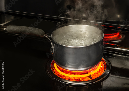 Boiling Pot of Water on Stove With Copy Space photo