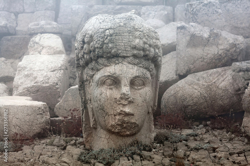 Ancient stone statue of goddess Tyche-Bakht on the top of Nemrut mount, Anatolia, Turkey photo