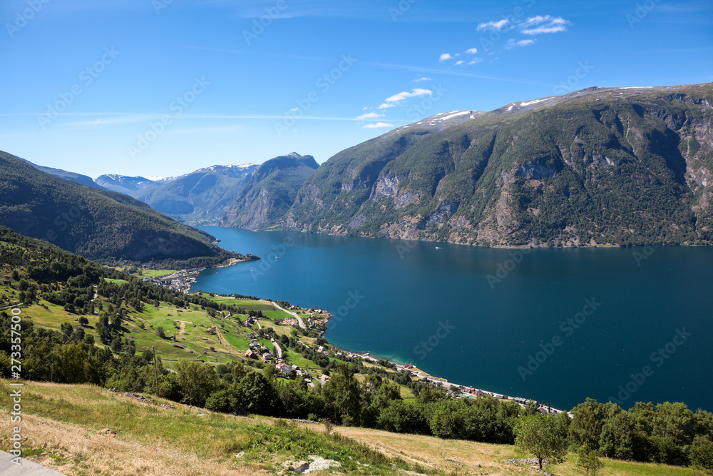 Aurlandsfjord fjord in Sogn og Fjordane county with mountain village Aurlandsvangen. Norway. Seen from route E16 and Stegastein viewpoint