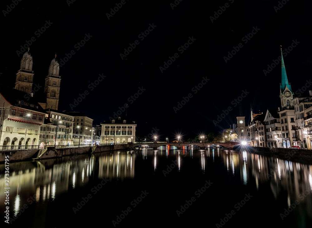 Fototapeta premium Zurich Night Scene of the Limmat River with light reflections and flares