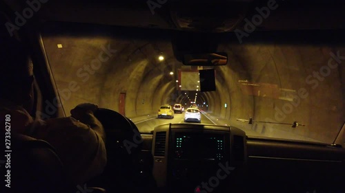 Cars driving through at Kanak tunnel Turkey in rush hour with beautiful road. View from car driving room.
