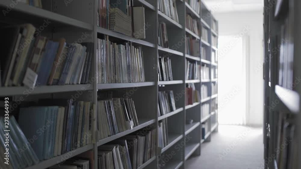 Dolly move of Library shelves with lots of books. Dolly move of Library shelves with lots of books.