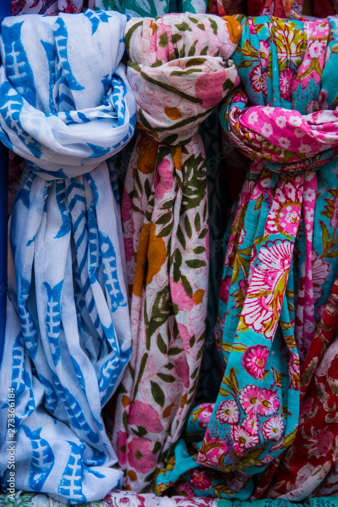 Colorful scarves on a market stall.