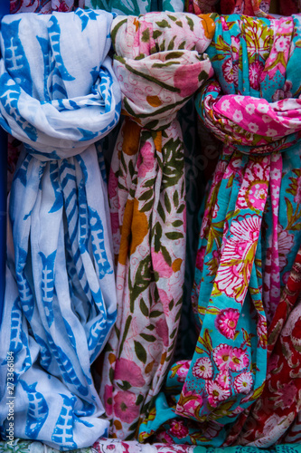 Colorful scarves on a market stall.