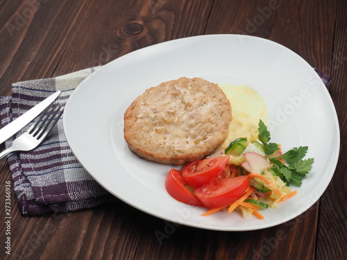 Meat cutlet with potato garnish